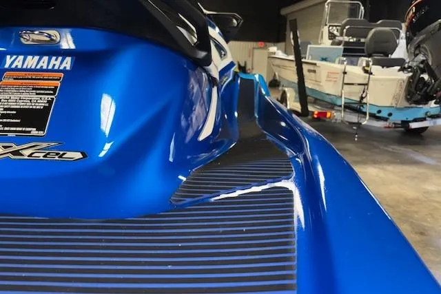 Slide: The Image of 2018 Yamaha WaveRunner VX Cruiser HO in a garage, showcasing sleek blue design. - 8