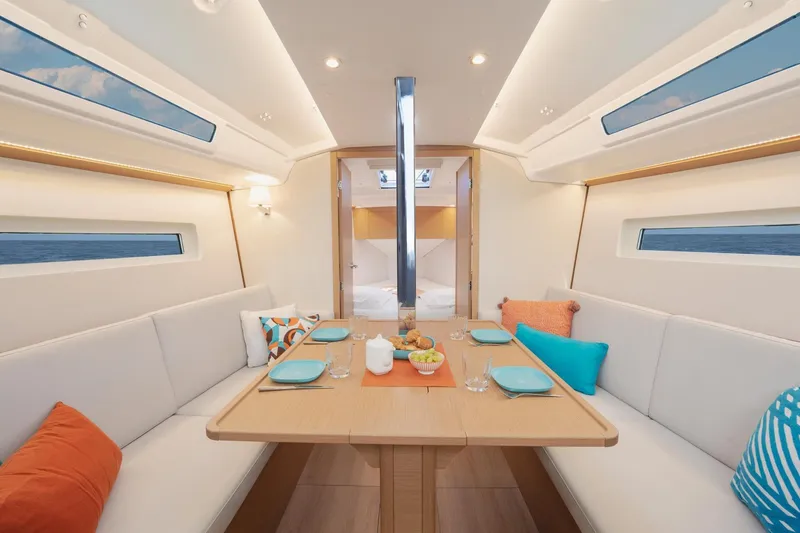 Slide: The Image of Luxurious interior of 2026 Jeanneau Sun Odyssey 350 yacht with elegant dining setup. - 10