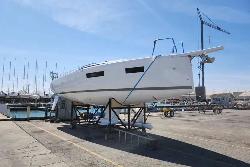 Slide: The Image of 2026 Jeanneau Sun Odyssey 350 sailboat on dry dock at marina. - 24