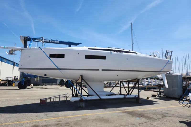 Slide: The Image of 2026 Jeanneau Sun Odyssey 350 sailboat on dry dock at marina. - 25