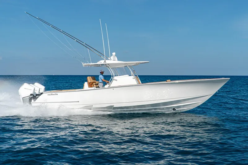 The Image of 2026 Valhalla Boatworks V-37 cruising on open water under clear blue skies. - 0