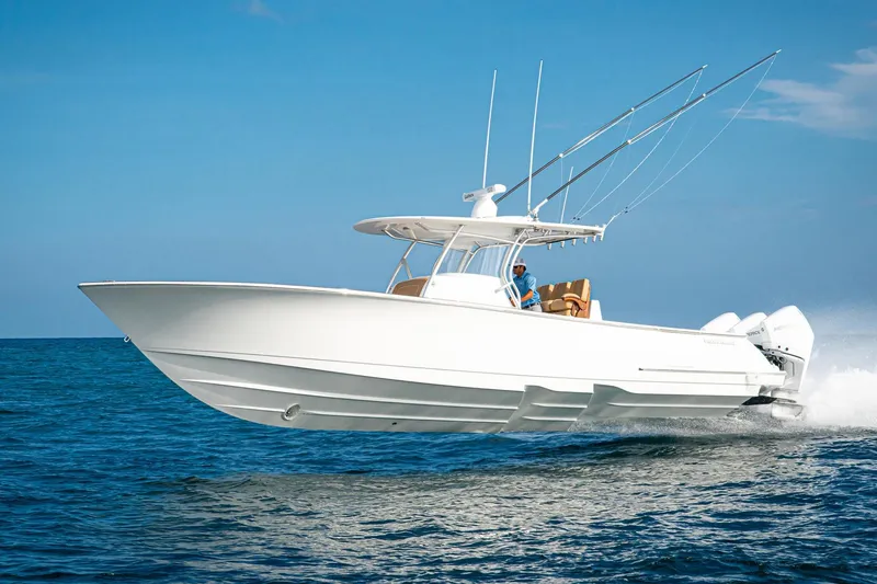Slide: The Image of 2026 Valhalla Boatworks V-37 cruising on open water under clear blue skies. - 1