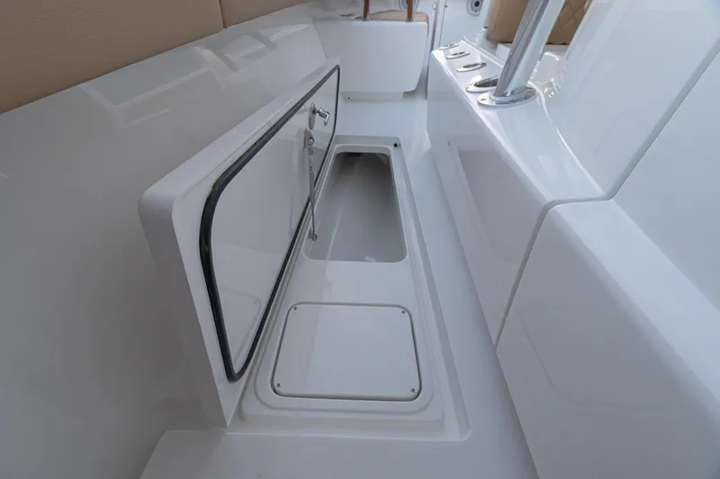 Slide: The Image of 2026 Valhalla Boatworks V-37 storage compartment with open hatch, showcasing sleek design. - 11