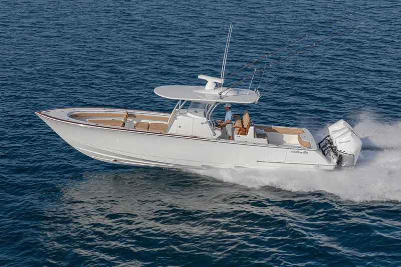 Slide: The Image of 2026 Valhalla Boatworks V-37 cruising on open water, showcasing sleek design and powerful engines. - 2