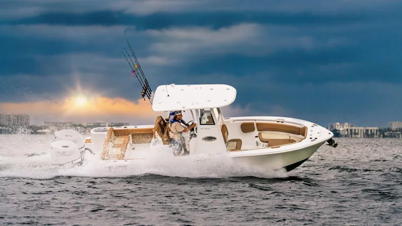 The Image of 2026 NauticStar 252 Legacy boat displayed indoors, featuring sleek design and dual engines. - 0