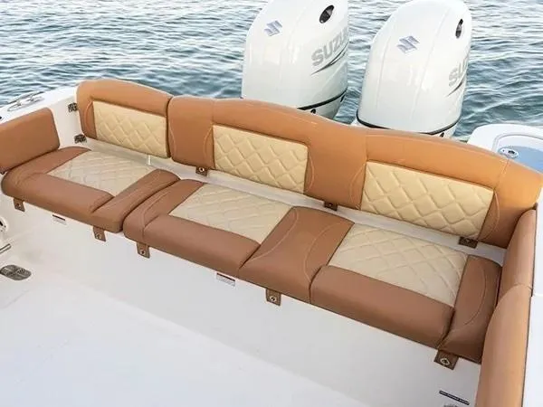 Slide: The Image of 2026 NauticStar 252 Legacy boat interior with seating and rod holders. - 10