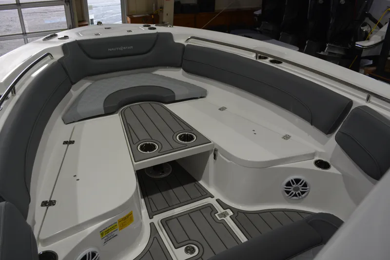 Slide: The Image of 2026 NauticStar 252 Legacy boat interior with gray seating and cup holders. - 13