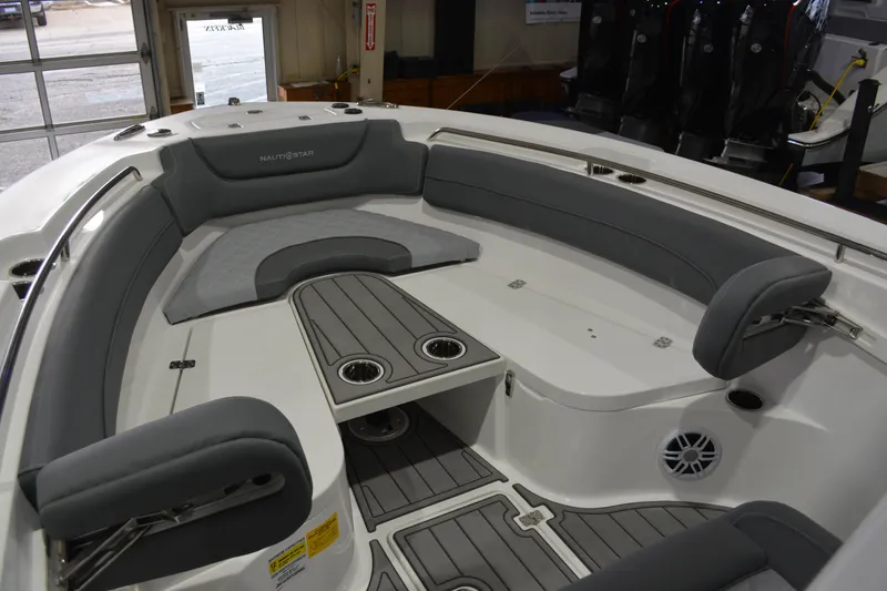 Slide: The Image of 2026 NauticStar 252 Legacy boat interior with gray seating and cup holders. - 14