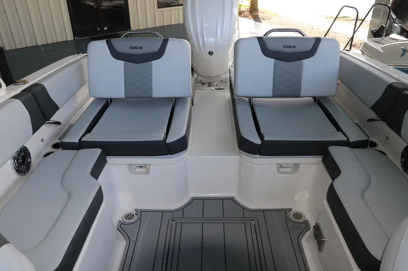Slide: The Image of 2026 Chaparral 250 OSX boat interior with stylish gray seating and modern design. - 10