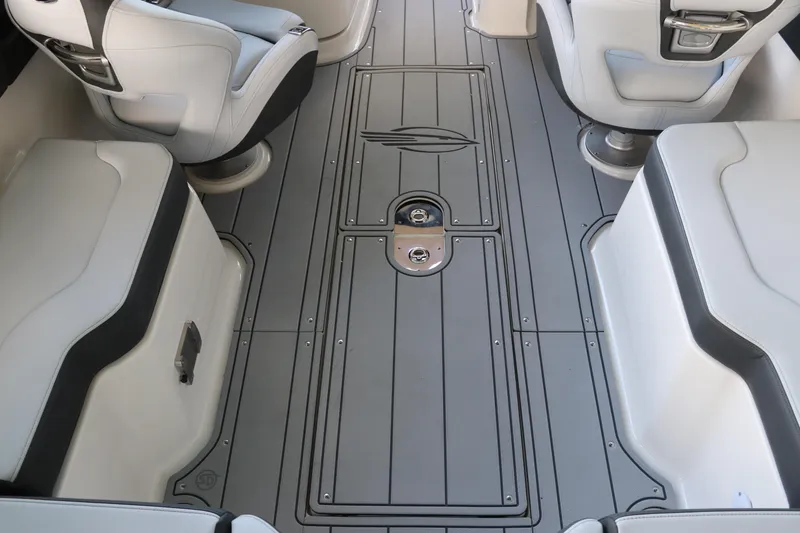 Slide: The Image of 2026 Chaparral 250 OSX boat interior with sleek seating and modern flooring design. - 22