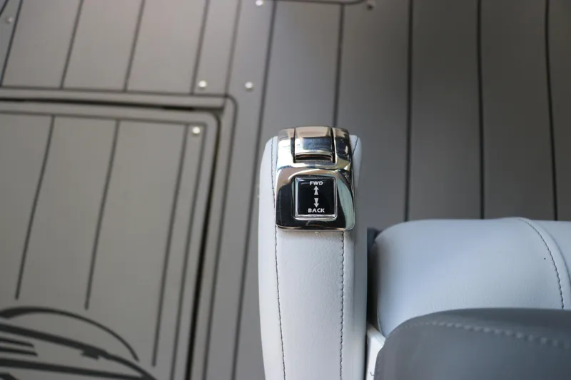 Slide: The Image of Throttle control lever on 2026 Chaparral 250 OSX boat, featuring forward and back directions. - 30