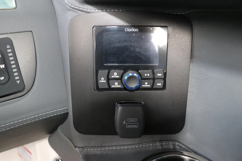 Slide: The Image of Clarion audio system in 2026 Chaparral 250 OSX boat dashboard. - 33