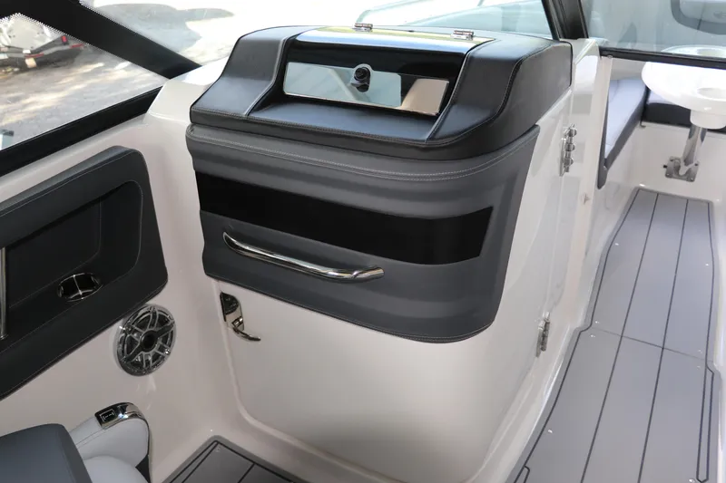 Slide: The Image of 2026 Chaparral 250 OSX boat interior with sleek design and modern features. - 44