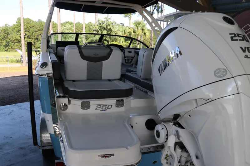 Slide: The Image of 2026 Chaparral 250 OSX boat with Yamaha engine, featuring sleek seating and modern design. - 5