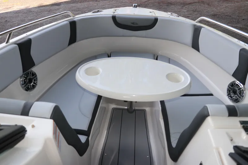 Slide: The Image of 2026 Chaparral 250 OSX boat interior with seating and table. - 52