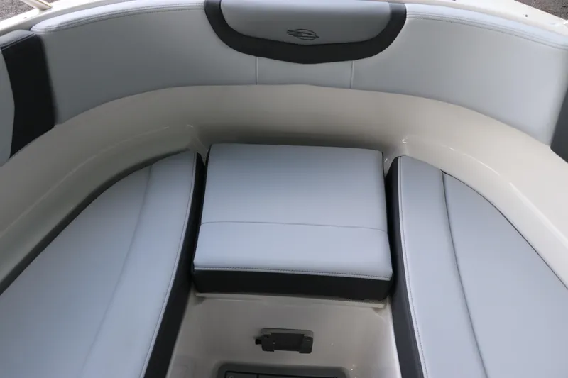 Slide: The Image of 2026 Chaparral 250 OSX boat interior with sleek, modern seating design. - 58