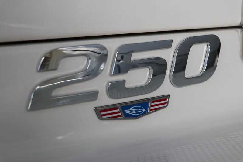 Slide: The Image of Chrome "250" emblem on 2026 Chaparral 250 OSX boat. - 6