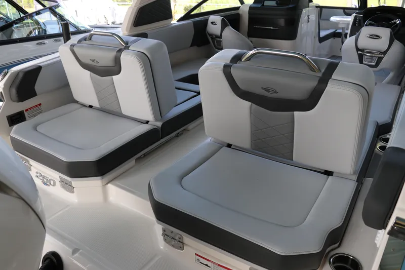 Slide: The Image of 2026 Chaparral 250 OSX boat interior with luxurious seating and modern design. - 7