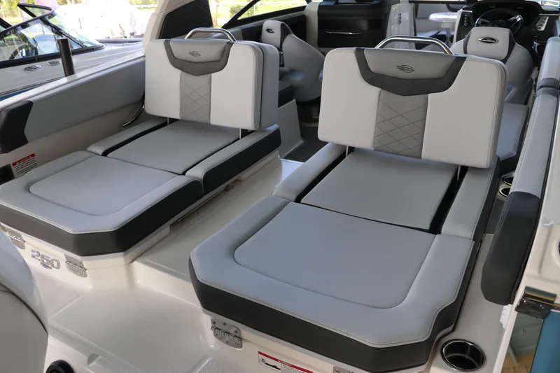 Slide: The Image of 2026 Chaparral 250 OSX boat interior with luxurious gray seating and modern design. - 8
