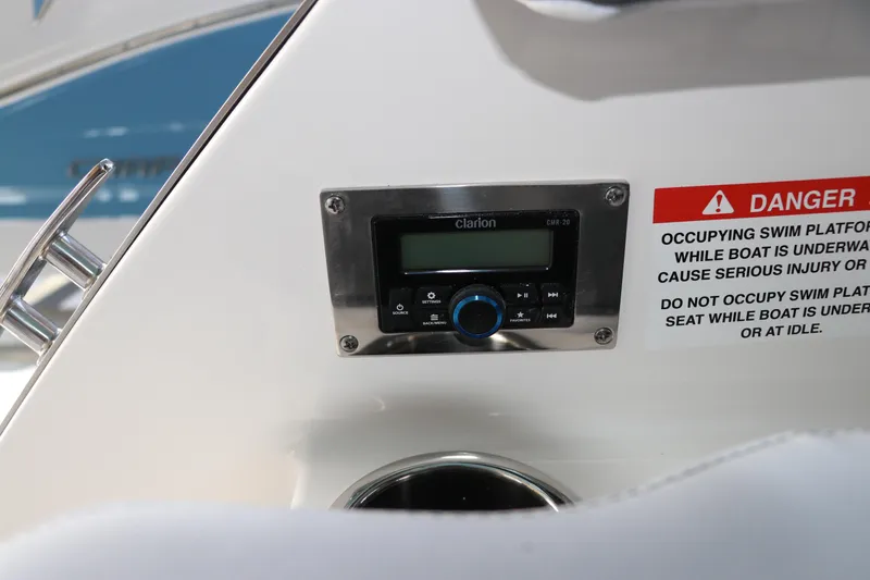 Slide: The Image of Control panel on 2026 Chaparral 250 OSX boat with safety warning label. - 9