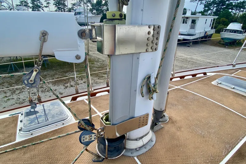 Slide: The Image of 1983 Liberty 38 Cutter sailboat deck with mast and rigging details. - 11