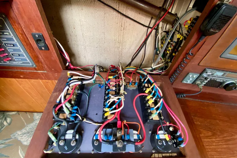 Slide: The Image of Electrical panel with wiring inside a 1983 Liberty 38 Cutter sailboat. - 31