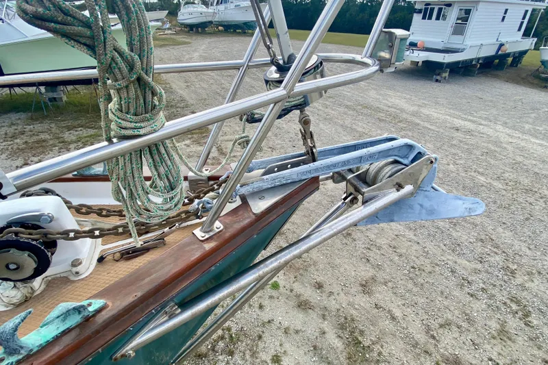 Slide: The Image of 1983 Liberty 38 Cutter sailboat anchor and bow detail in a boatyard. - 33