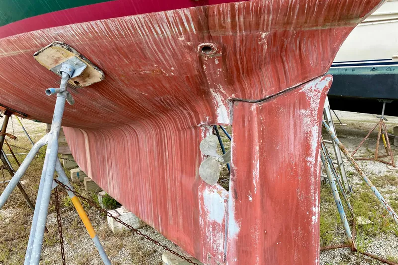 Slide: The Image of 1983 Liberty 38 Cutter sailboat hull on stands, showing propeller and keel. - 41