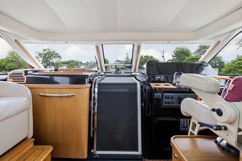 Slide: The Image of Interior of 2003 Tiara Yachts 5200 Sovran, featuring helm and seating area. - 14