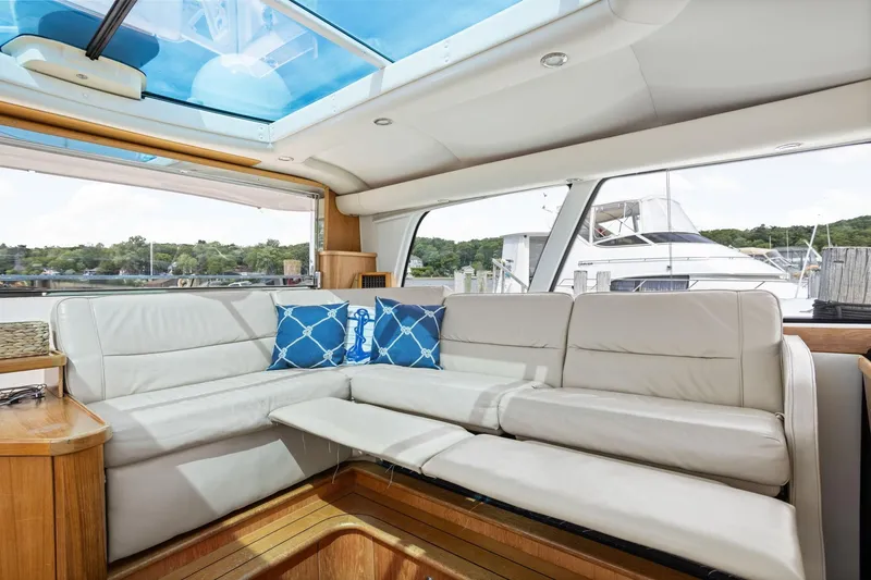 Slide: The Image of Luxurious interior of 2003 Tiara Yachts 5200 Sovran with leather seating and nautical decor. - 18