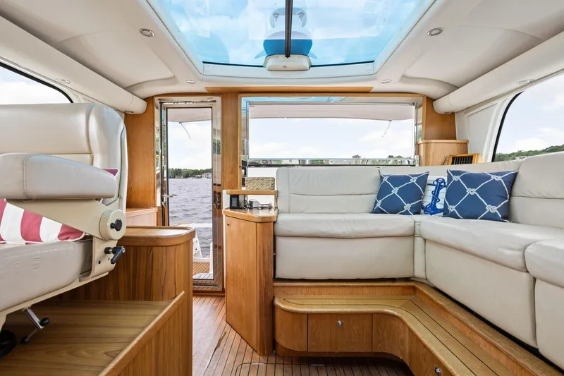 Slide: The Image of Luxurious interior of 2003 Tiara Yachts 5200 Sovran with plush seating and scenic view. - 20