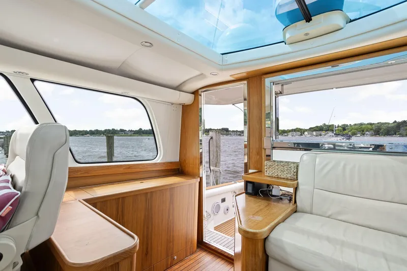 Slide: The Image of Interior of 2003 Tiara Yachts 5200 Sovran with scenic water view through windows. - 21