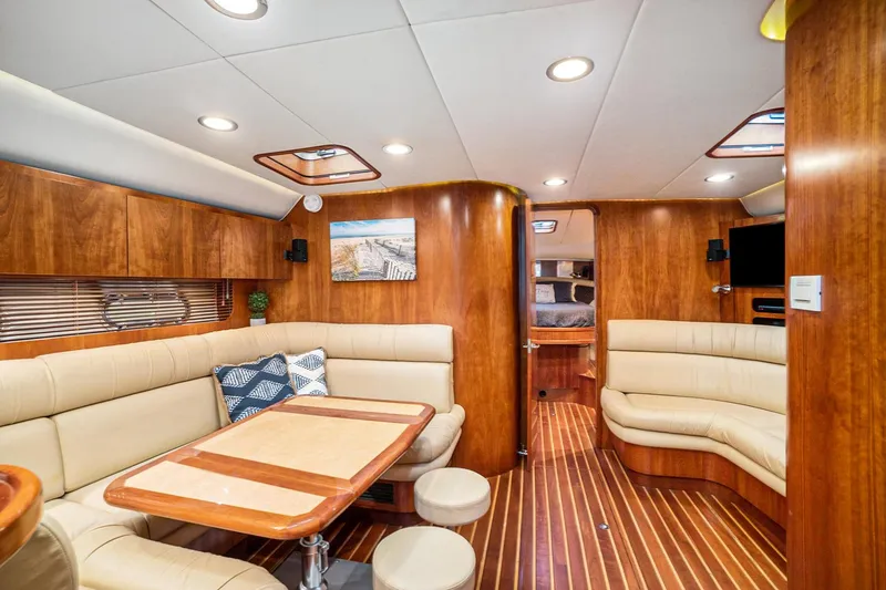 Slide: The Image of Luxurious 2003 Tiara Yachts 5200 Sovran interior with elegant wood finish and plush seating. - 24