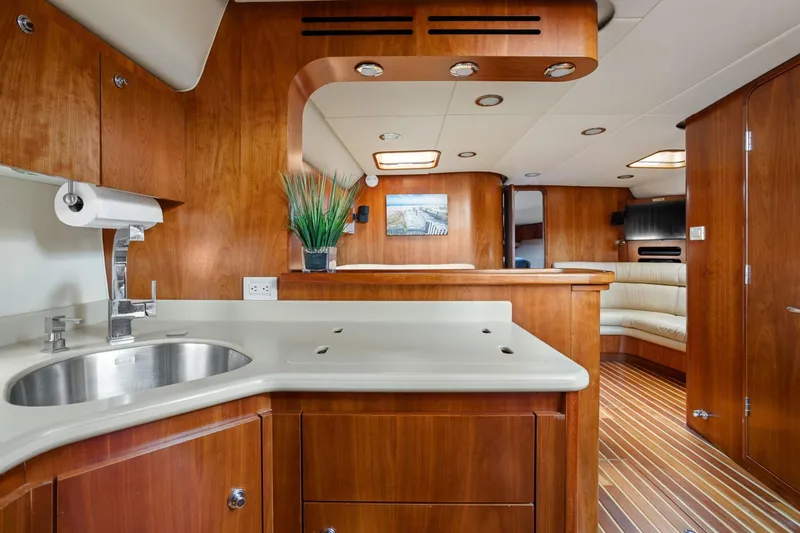 Slide: The Image of Luxurious interior of 2003 Tiara Yachts 5200 Sovran with wood finish and modern amenities. - 27