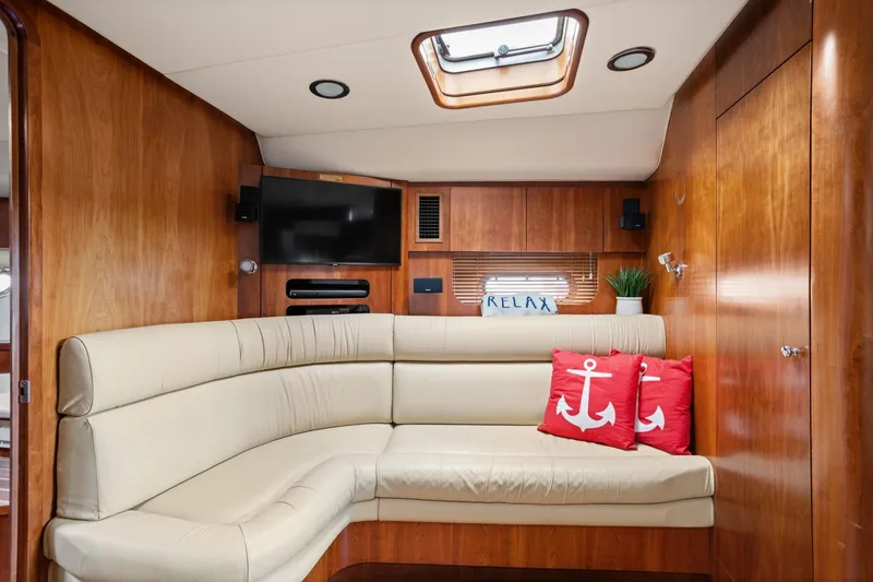 Slide: The Image of Luxurious 2003 Tiara Yachts 5200 Sovran interior with beige seating and nautical decor. - 30