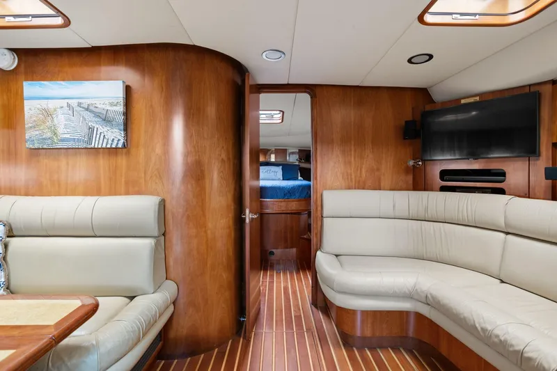 Slide: The Image of Luxurious interior of 2003 Tiara Yachts 5200 Sovran with elegant wood paneling and plush seating. - 32