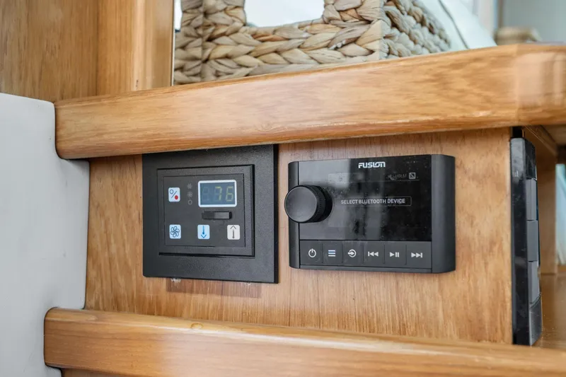 Slide: The Image of Control panel and Bluetooth device on 2003 Tiara Yachts 5200 Sovran interior. - 43