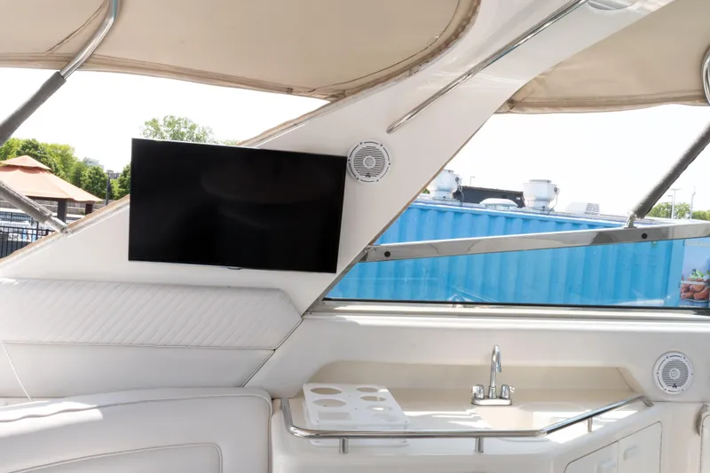 Slide: The Image of Interior of 1996 Sea Ray 630 Super Sun Sport yacht with TV and sink. - 10