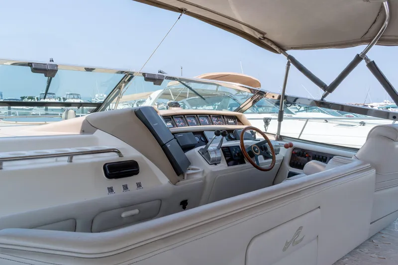 Slide: The Image of Interior view of a 1996 Sea Ray 630 Super Sun Sport yacht cockpit. - 13