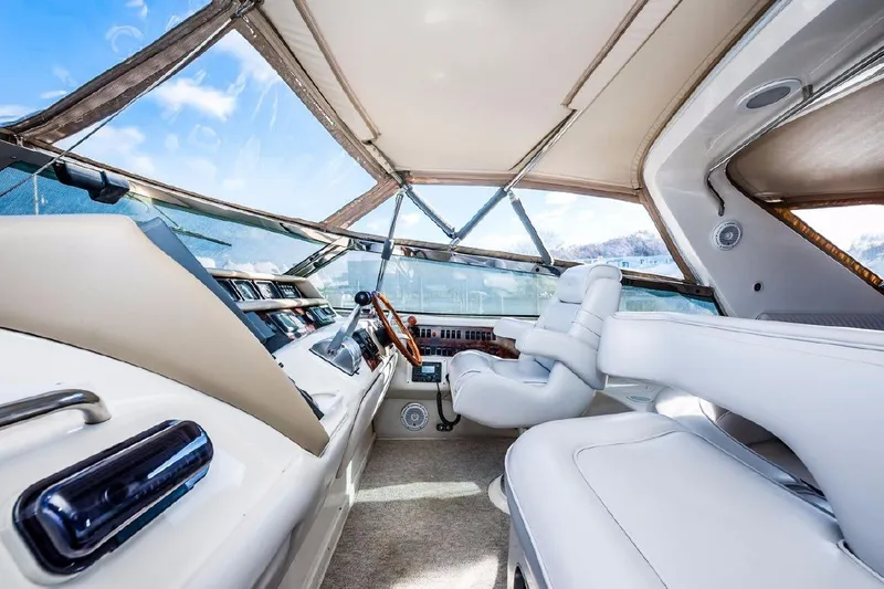 Slide: The Image of Interior of 1996 Sea Ray 630 Super Sun Sport yacht with luxurious seating and controls. - 14