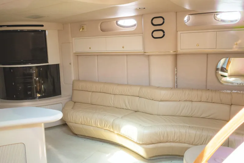 Slide: The Image of Luxurious interior of 1996 Sea Ray 630 Super Sun Sport yacht with beige leather seating. - 16