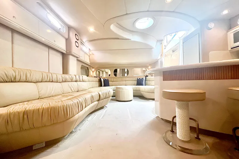 Slide: The Image of Luxurious interior of 1996 Sea Ray 630 Super Sun Sport yacht with plush seating. - 17