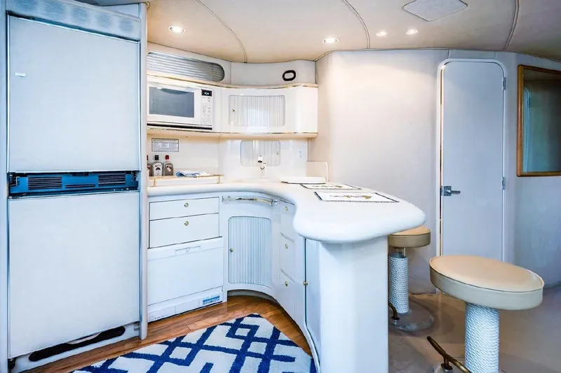 Slide: The Image of Luxurious 1996 Sea Ray 630 Super Sun Sport yacht interior with modern kitchen and seating. - 18