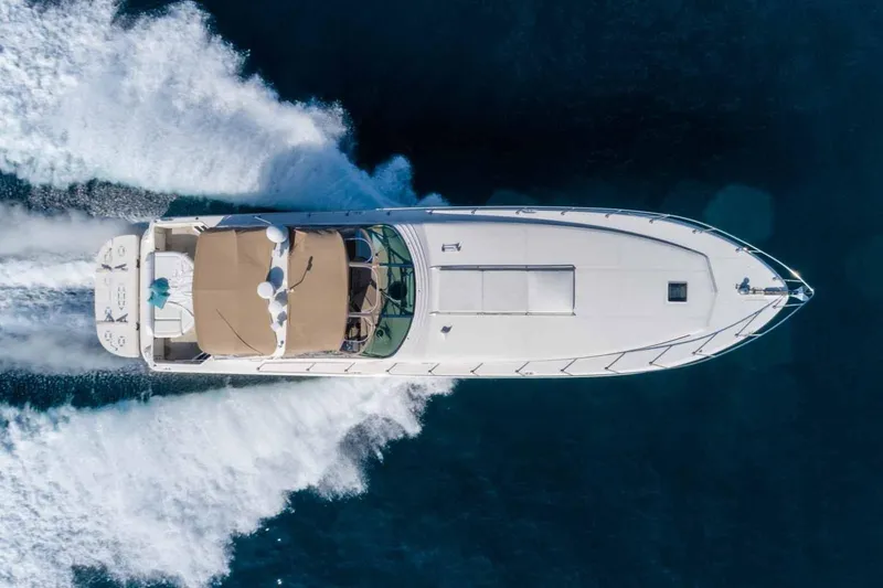 Slide: The Image of Aerial view of 1996 Sea Ray 630 Super Sun Sport yacht cruising on open water. - 3
