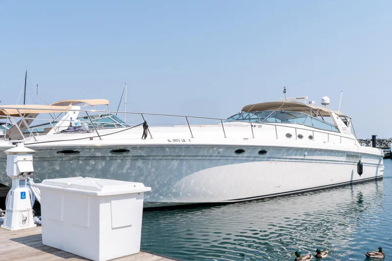 Slide: The Image of 1996 Sea Ray 630 Super Sun Sport yacht docked at marina. - 5