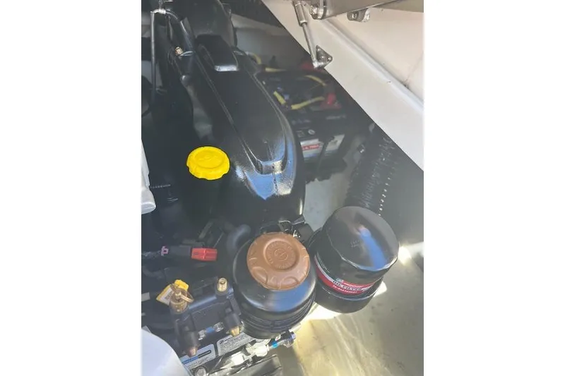 Slide: The Image of Engine compartment of 2021 Chaparral 307 SSX boat, showing components and wiring. - 4
