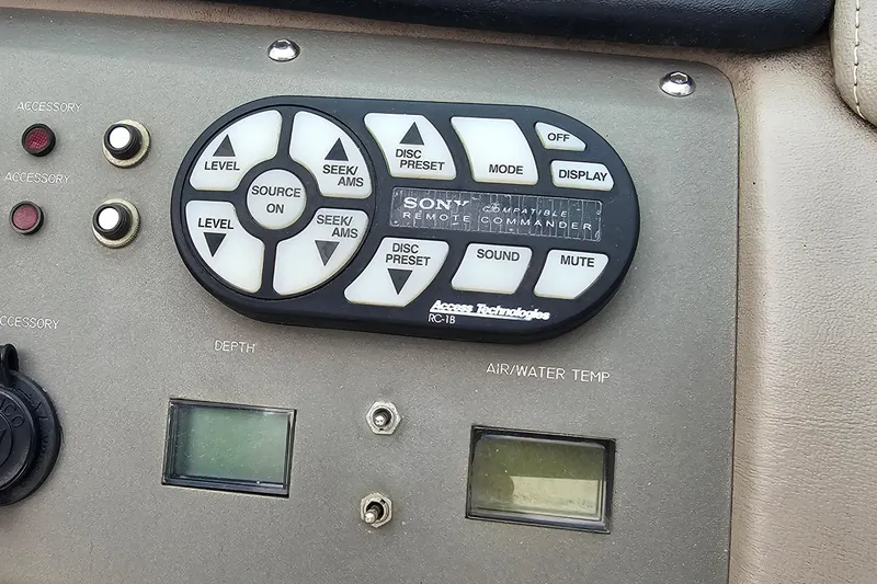 Slide: The Image of Control panel of a 2003 Cobalt 220 boat with Sony remote and displays. - 15