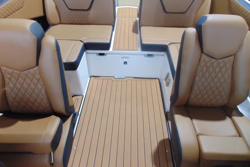 Slide: The Image of Luxurious interior of 2026 Yamaha Boats 222SD with tan leather seating and wood-style flooring. - 9