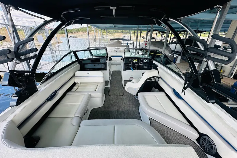 Slide: The Image of 2018 Cobalt CS23 Surf boat interior with white seating and modern dashboard. - 14