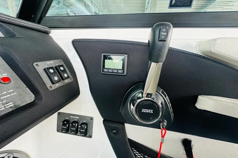 Slide: The Image of Control panel of a 2018 Cobalt CS23 Surf boat with Volvo Penta throttle. - 24